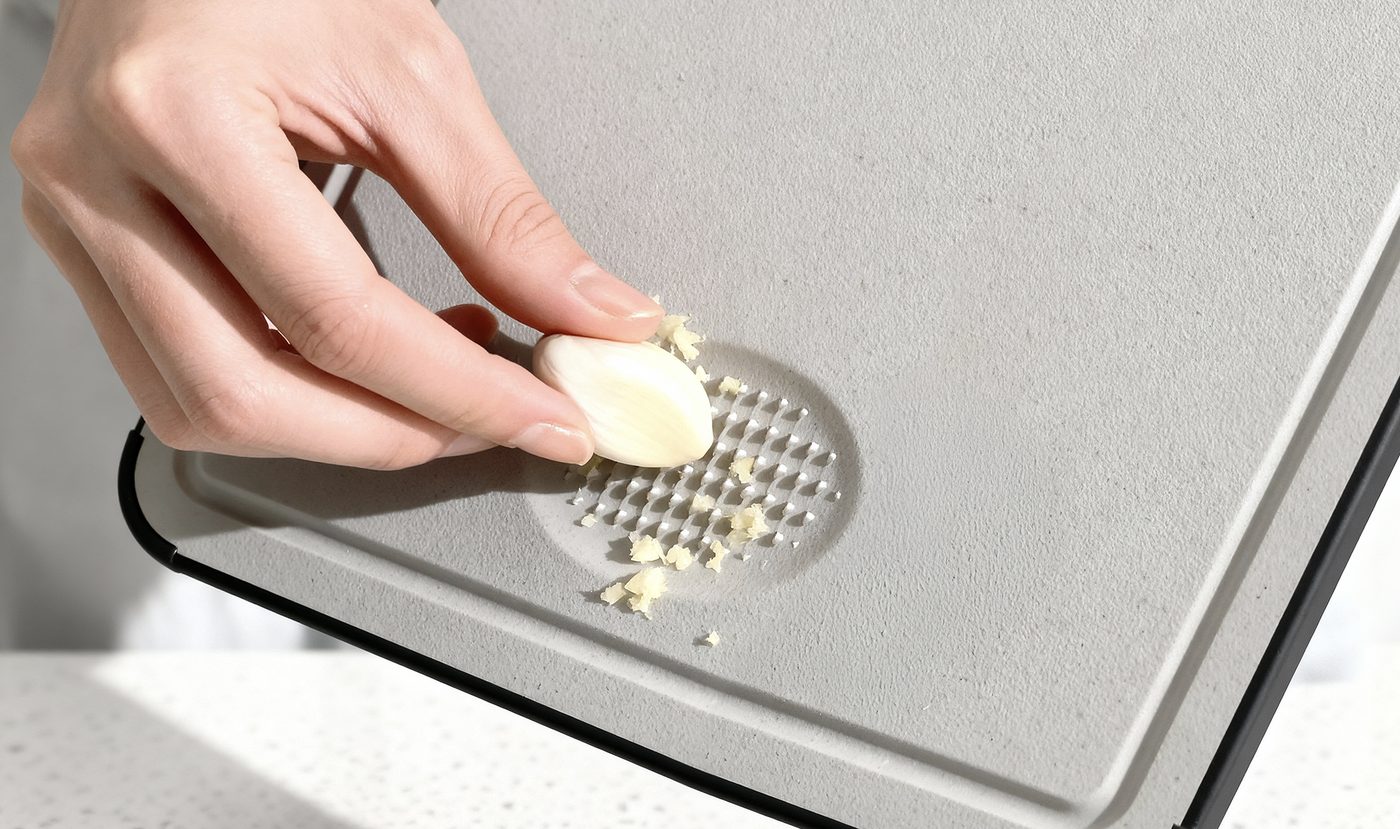 Textured grinding area on the TIBO board for garlic and ginger